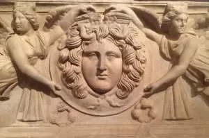 Medusa Head held by two angels carved on a sarcophagus at Ephesus Museum